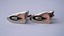 3256 c. 1950s parabolic silver tone (chromed) modernistic cufflinks with pink and black accents. No maker’s mark. Med. size, roughly 1” x 5/8” at widest point. Price: $25